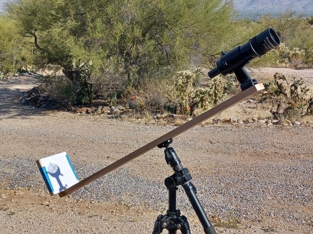 A simple finder scope mounted to a piece of lumber projects a clear image of the Sun.