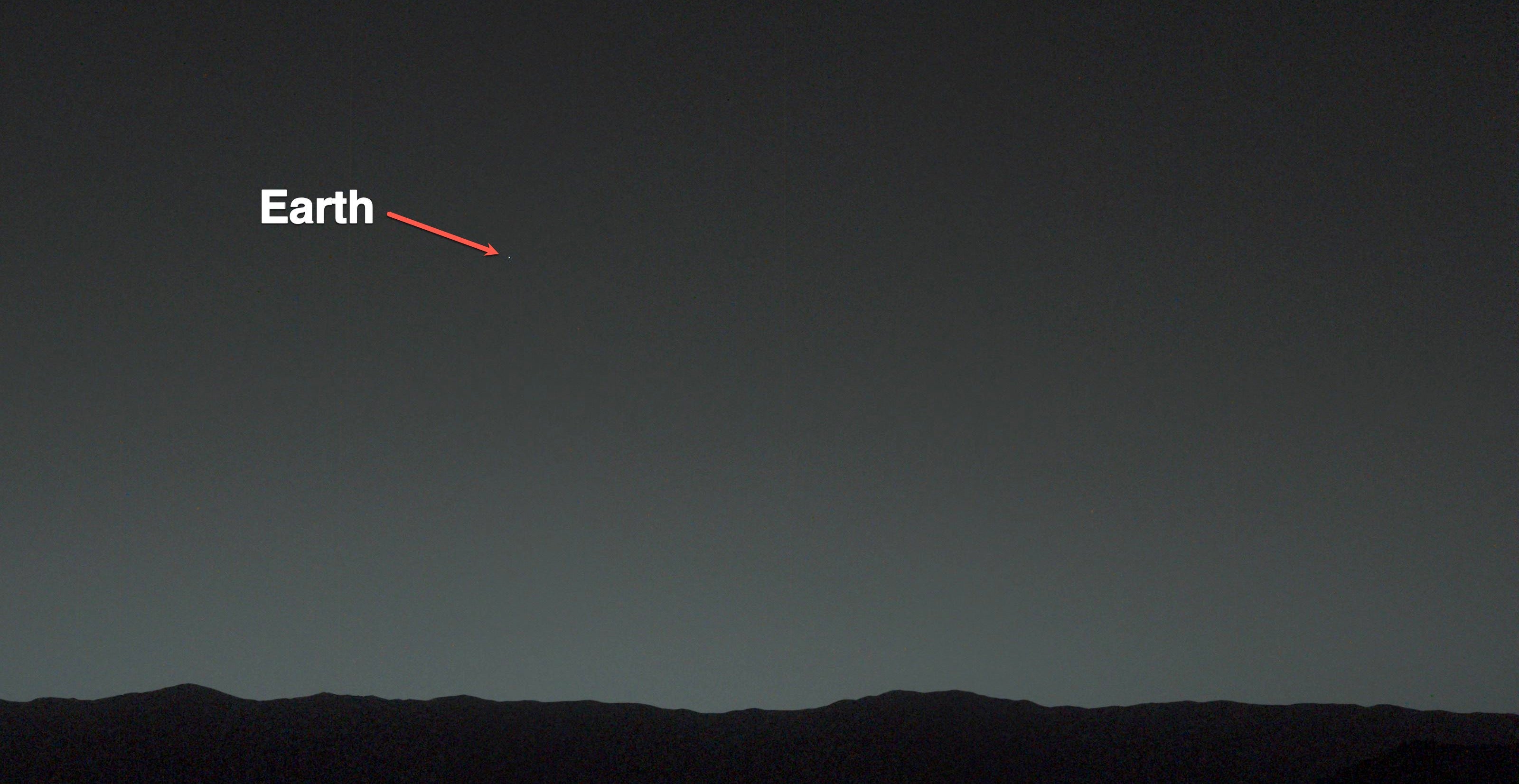 This view of the twilight sky and Martian horizon taken by NASA Curiosity Mars rover includes Earth as the brightest point of light in the night sky. Earth is a little left of center in the image, and our moon is just below Earth.