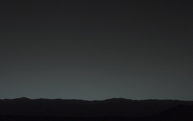 This view of the twilight sky and Martian horizon taken by NASA Curiosity Mars rover includes Earth as the brightest point of light in the night sky. Earth is a little left of center in the image, and our moon is just below Earth. Credit: NASA
