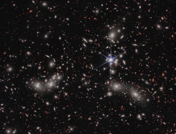 Astronomers estimate 50,000 sources of near-infrared light are represented in this image from NASA’s James Webb Space Telescope. A foreground star in our own galaxy, to the right of the image center, displays Webb’s distinctive diffraction spikes. Bright white sources surrounded by a hazy glow are the galaxies of Pandora’s Cluster, a conglomeration of already-massive clusters of galaxies coming together to form a megacluster. Credit: NASA, ESA, CSA, Ivo Labbe (Swinburne), Rachel Bezanson (University of Pittsburgh), Alyssa Pagan (STScI).