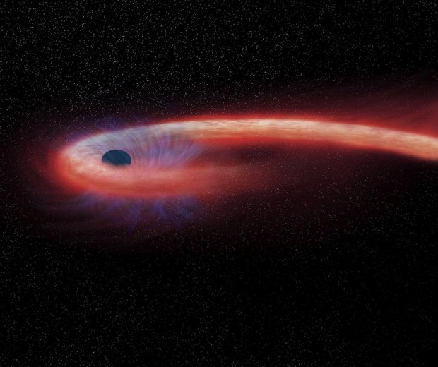 Black holes, like the one in this illustration, can emit energetic neutrinos. Credit: NASA/Chandra X-ray Observatory.