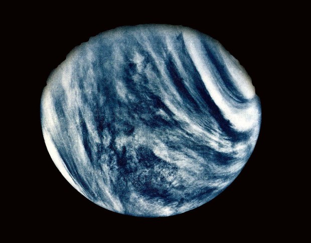 On Feb. 5, 1974, NASA's Mariner 10 mission took this first close-up photo of Venus. Made using an ultraviolet filter in its imaging system, the photo has been color-enhanced to bring out Venus's cloudy atmosphere as the human eye would see it. Credit: NASA.
