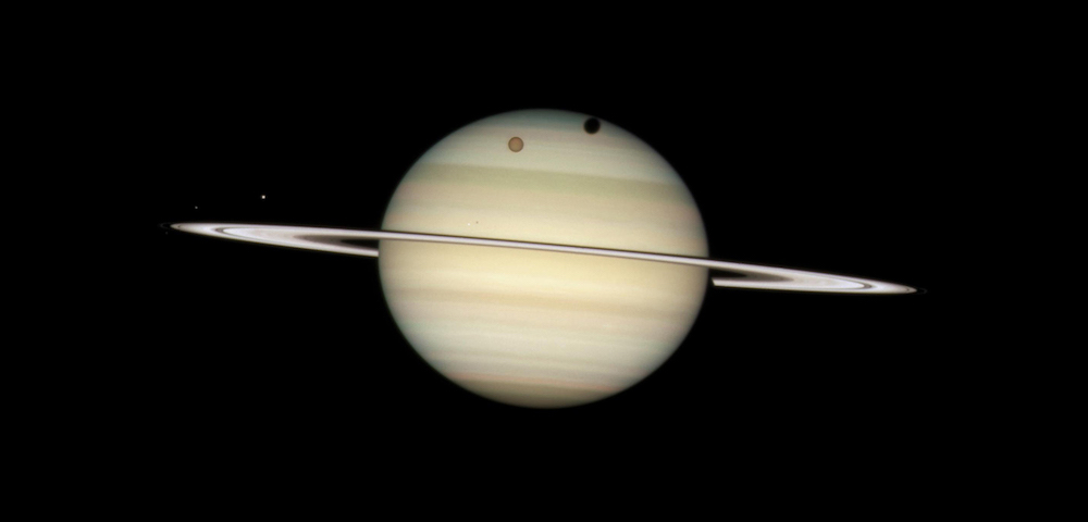 Saturn and moons, as images by Hubble