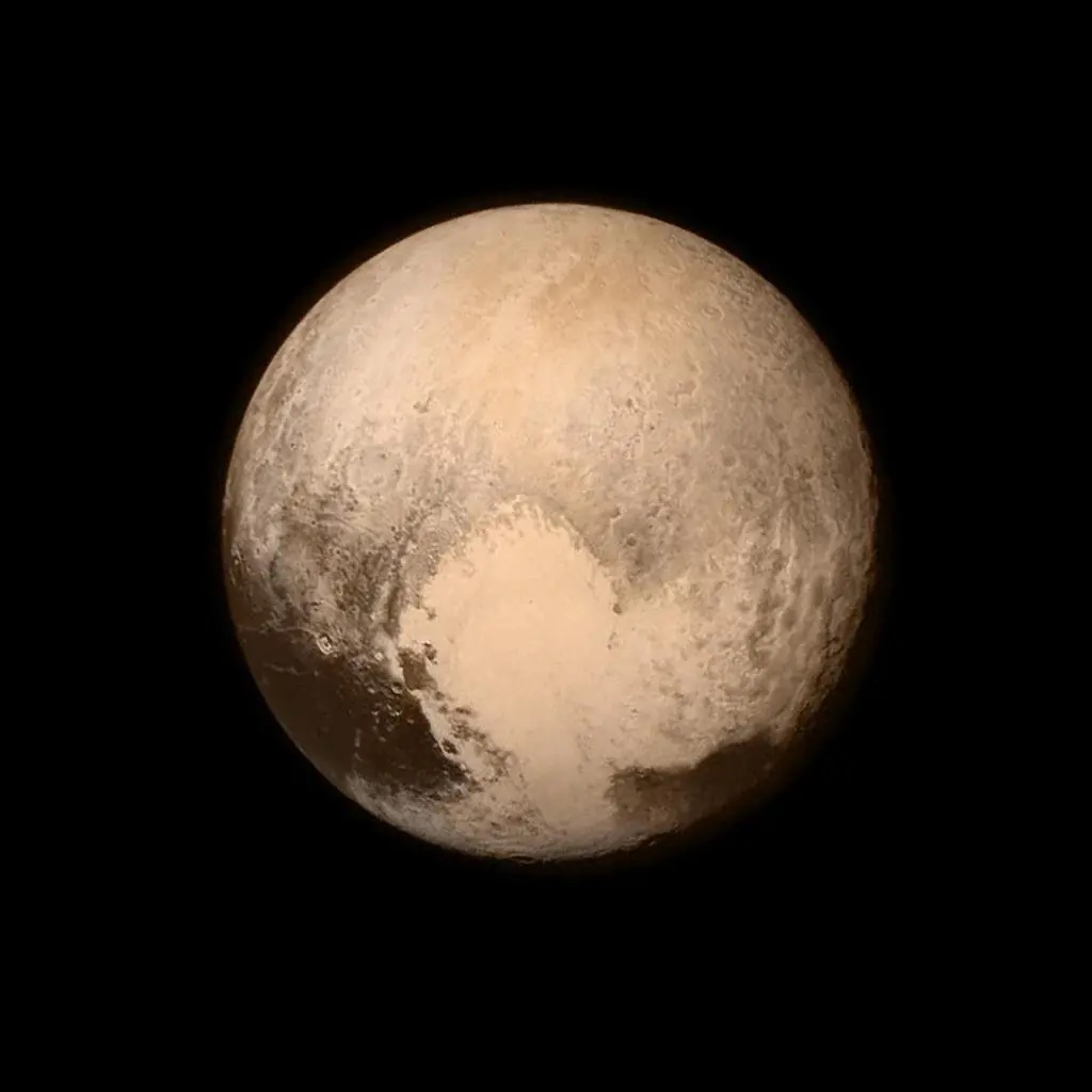 A color image of Pluto shows its heart-shaped section.