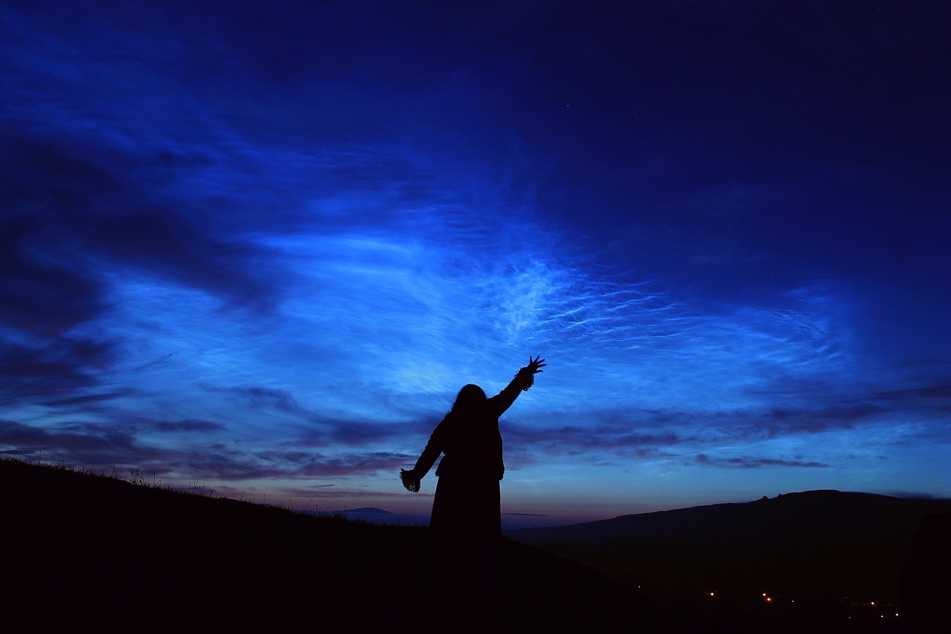 Noctilucent clouds, or NLC, appear in the sky during the summer months in stunning displays. Credit: Stuart Atkinson